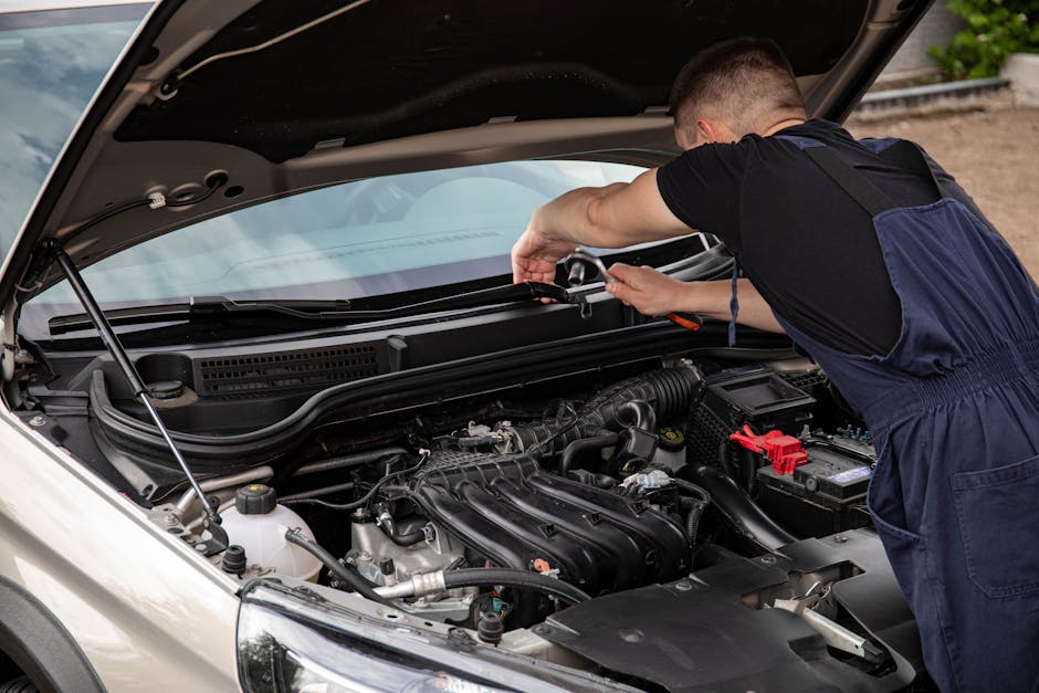 Mechanic using impact wrench for tire installation