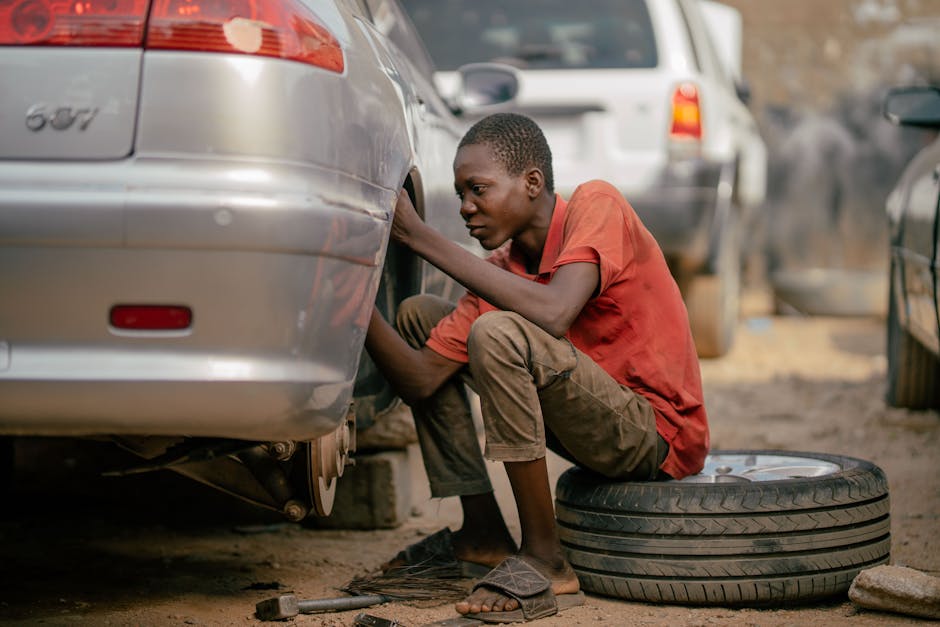 Professional mechanic changing a car tire